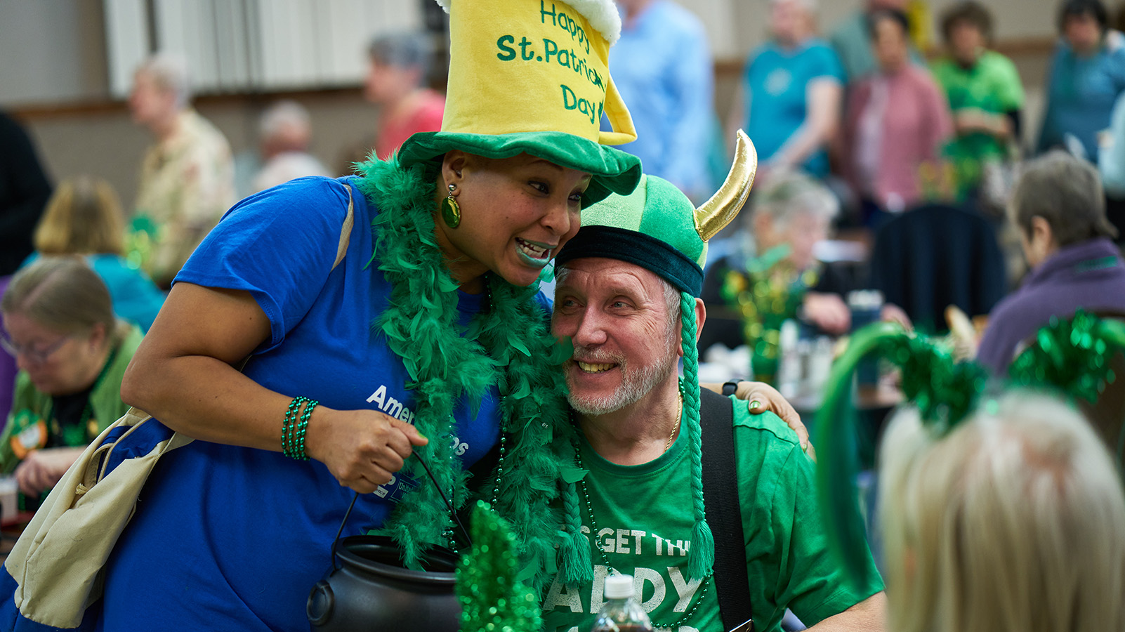 rsvp volunteer with elderly man at St. Patricks day celebration